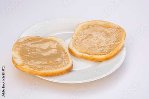 Peanut butter sandwich breakfast or snack on white background.