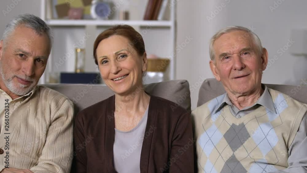 Positive aged people smiling on camera, social security, healthy pensioners