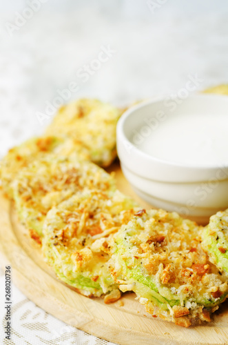 baked parmesan zucchini crisps with cream sauce photo