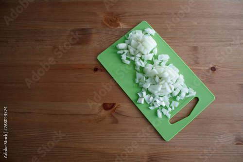 cabbage cut on a green cutting Board on a wooden table and a light background close-up