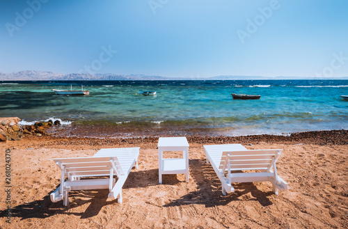 lounge chairs on beautiful tropical beach at Egypt, Dahab © Kotangens