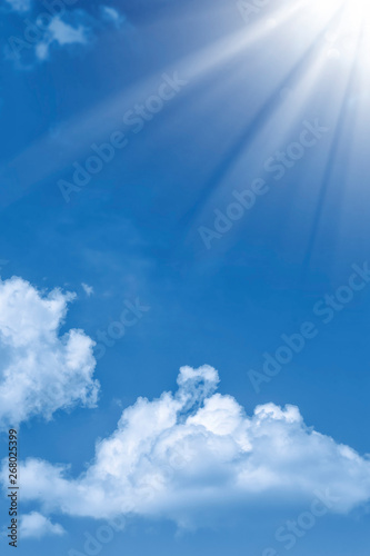 Blurred background. Blue sky and white fluffy clouds.