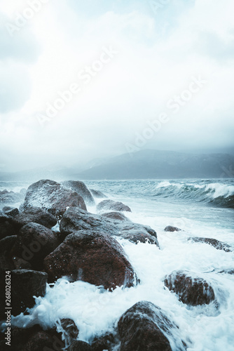 waves crashing into rocks photo