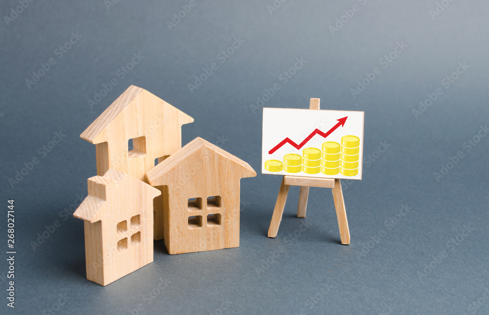 Φωτογραφία Wooden figures of houses and a poster with golden coins