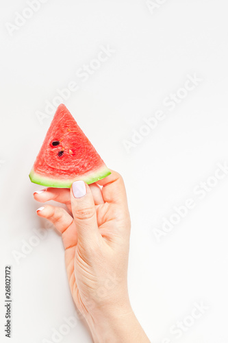 Fresh watermelon slices in woman hands