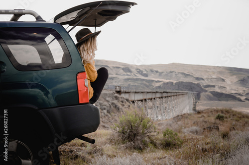 woman sitting in vehicle