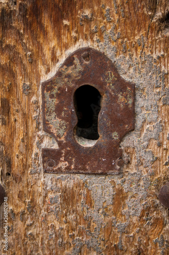 Old lock on old wooden door