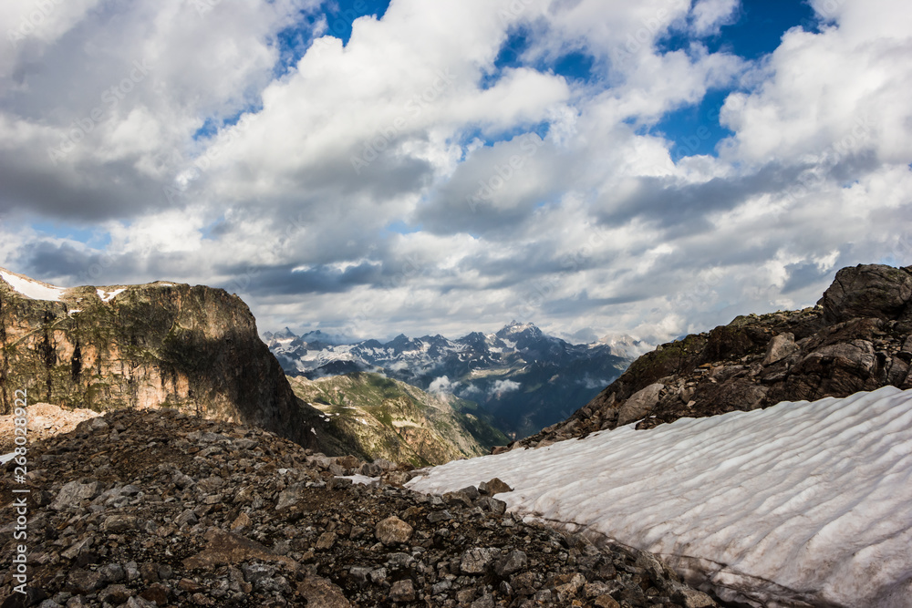 Fototapeta premium high mountains covered with snow and ice, peaks and valleys in the Caucasus