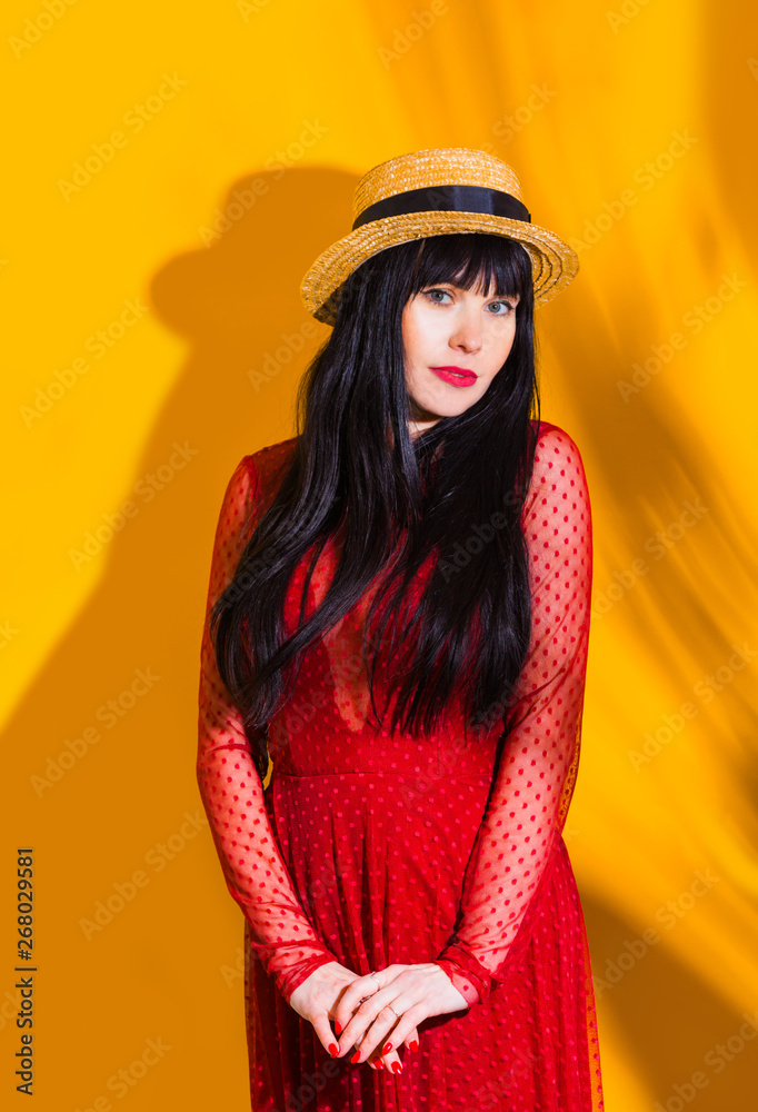 girl hat sun light shadow tropical yellow orange young woman background red dress girl hat sun light shadow tropical yellow orange young woman background red dress