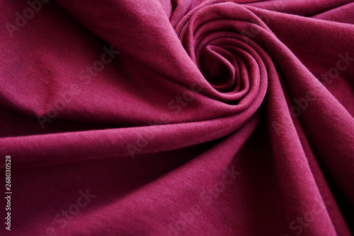 Spiral shape form of wave pink color tone clothes and fabric textile background
