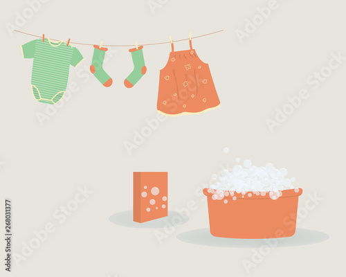Washing: washed baby clothes cute Capri pants,socks and  bodysuit hanging on clothesline and they are attached by clothespins.Wash basin with soap foam and pack of washing powder.Vector illustration