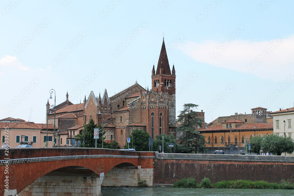 Fototapeta premium Verona old town in Italy with historical architecture and the river on a clear summer day