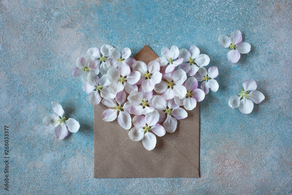 Postcard background with envelope and flowers of the apple tree in the shape of a heart Postcard background with envelope and flowers of the apple tree in the shape of a heart