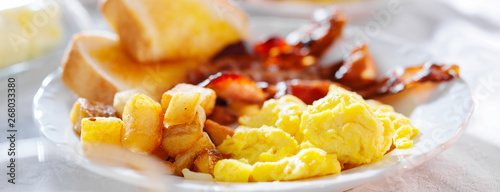breakfast with eggs bacon and hashbrowns panorama