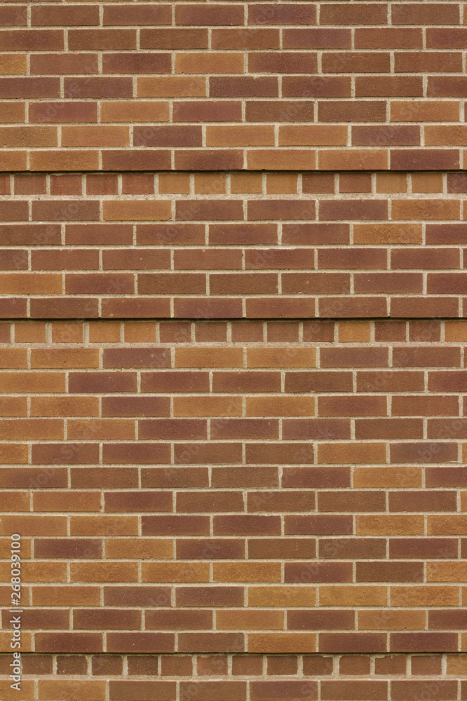 Reddish brown abstract brick wall background in common bond pattern with overlapping effect Reddish brown abstract brick wall background in common bond pattern with overlapping effect