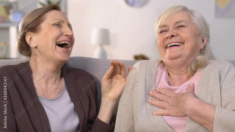 Female friends laughing at funny stories, having fun together, girls talks Female friends laughing at funny stories, having fun together, girls talks