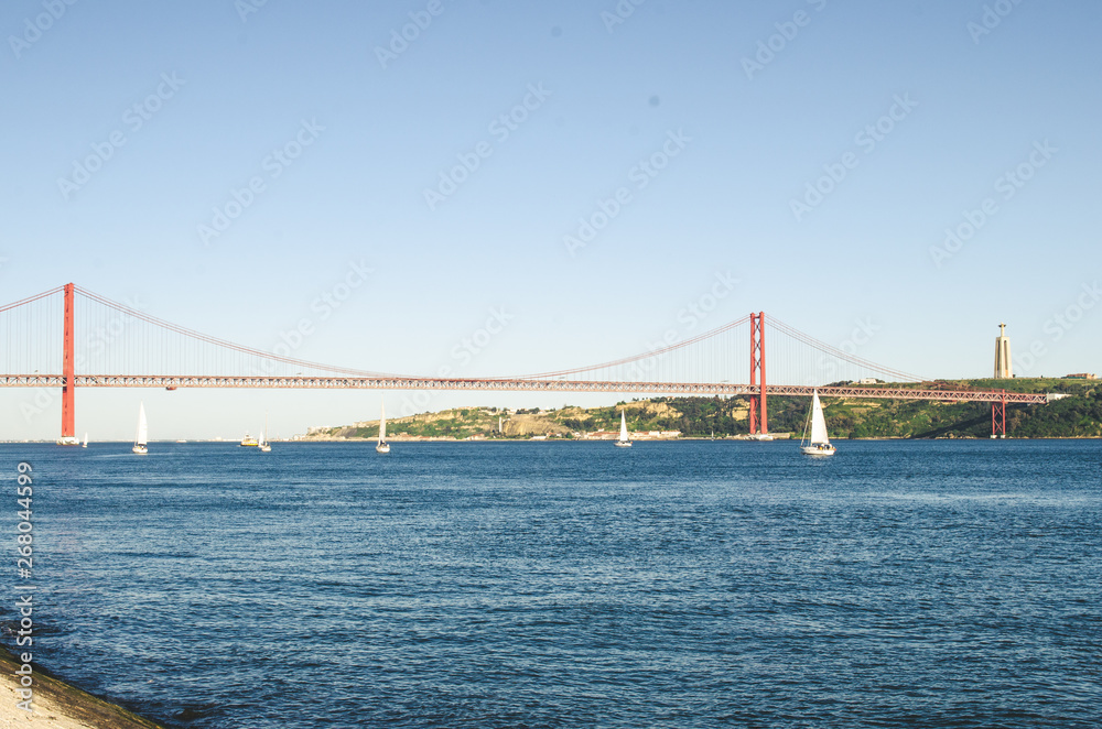 Fototapeta premium part of red 25 april bridge in Lisbon