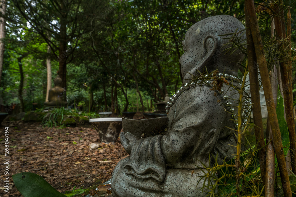 Chinese Buddha statue Located in a forest park. Chinese Buddha statue Located in a forest park.