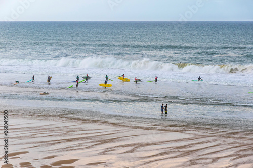 Unrecognisable surfers in the water on the Atlantic coast of France near Lacanau-Ocean, Bordeaux, France photo