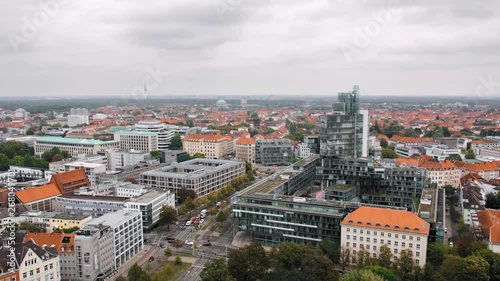 Hannover, Germany a bird's-eye view. The combination of modern and ancient architecture. Modern house on the background of the old town. In the frame of the road, cars. Slow Motion. photo