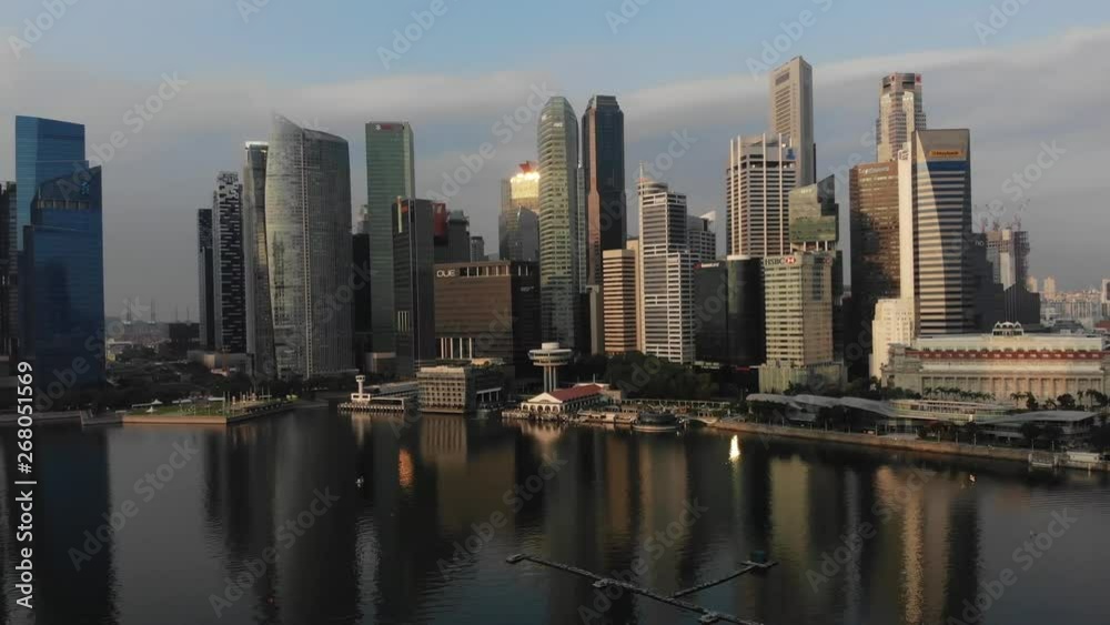 Aerial panoramic view of the financial district in Singapore with drone flying backwards while descending slowly Aerial panoramic view of the financial district in Singapore with drone flying backwards while descending slowly