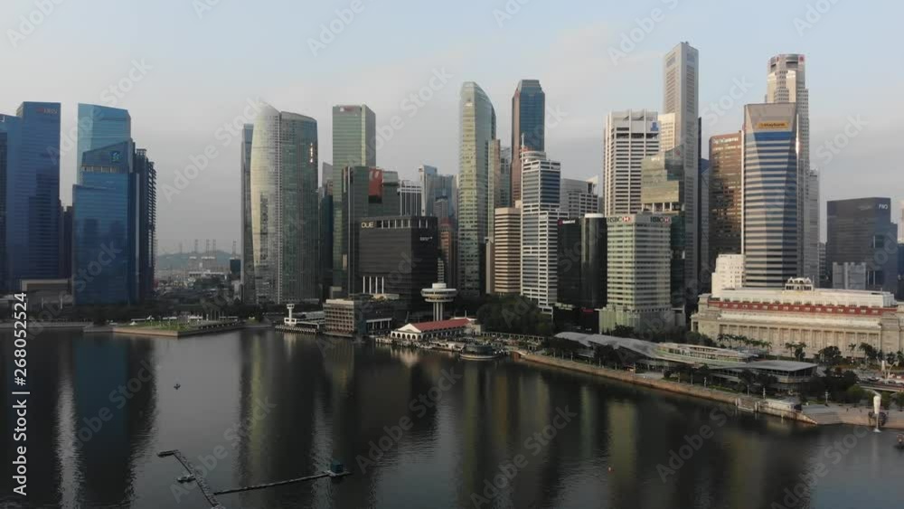 Aerial panoramic view of the financial district in Singapore with drone flying forward Aerial panoramic view of the financial district in Singapore with drone flying forward