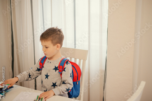 Little boy preparing for school.