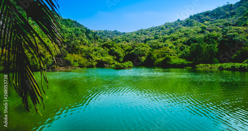 The sweet water lake near the ocean. a rare sight seeing fresh water so close to the sea. surrounded by mountains on three sides. photo