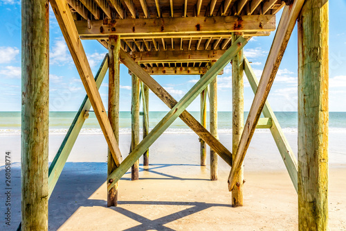 Fototapeta Naklejka Na Ścianę i Meble -  Sandy beach and pier on Edisto Island, South Carolina
