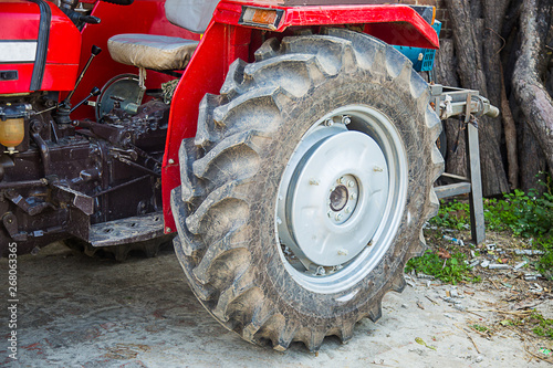 Big tyre of the tractor used in india for farming machine, rubber close-up, background - image
