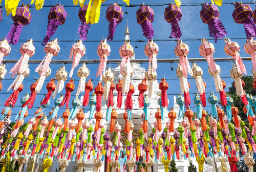 Rows of traditional paper lantern hanging on above during Yi peng  or Yee peng  festival in Wat Phra That Hariphunchai  Lamphun province  Thailand.