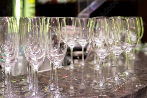 a lot of glasses on the bar