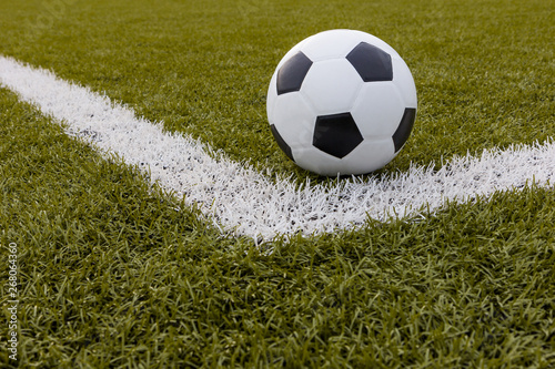 Soccer ball  Football on artificial grass with white stripe