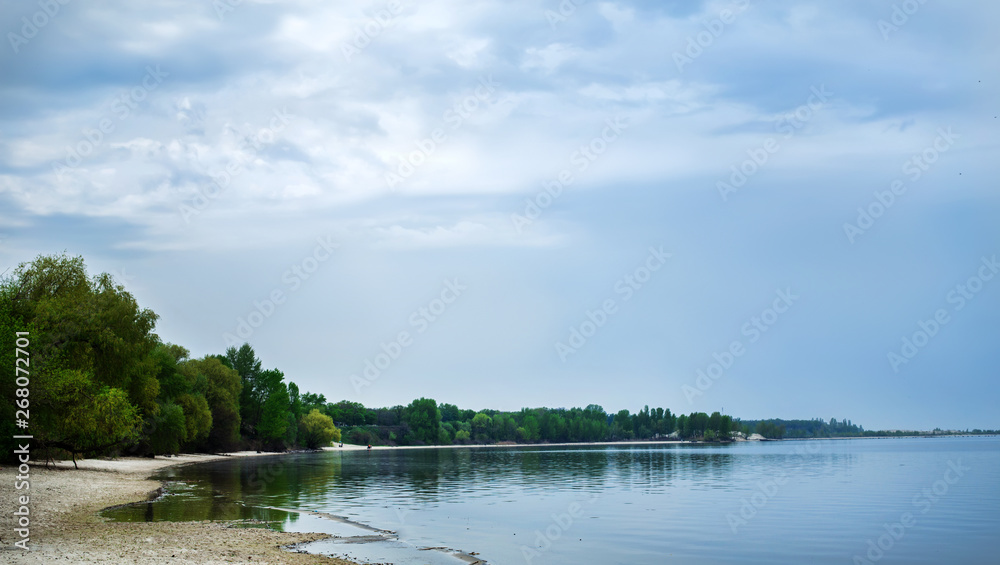  summer landscape of a large river and sky, as a screensaver or background, serenity.