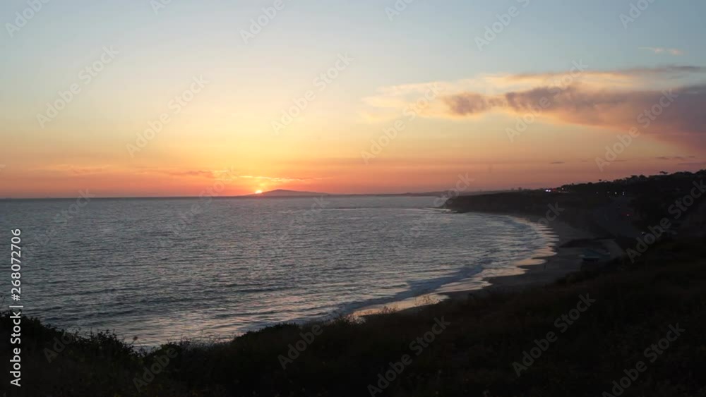 The sun setting over beautiful Newport Beach community as seen from the PCH cliffside. The sun setting over beautiful Newport Beach community as seen from the PCH cliffside.