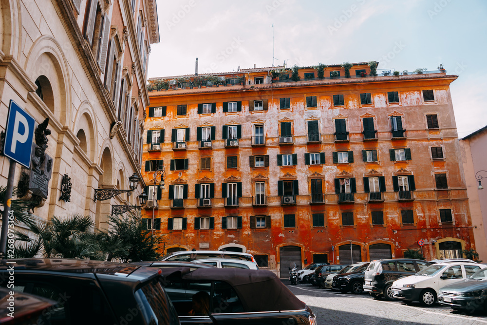 Building, the old home of the red-orange colors, lots of Windows, on the roof of trees | ROME, ITALY - 12 SEPTEMBER 2018.