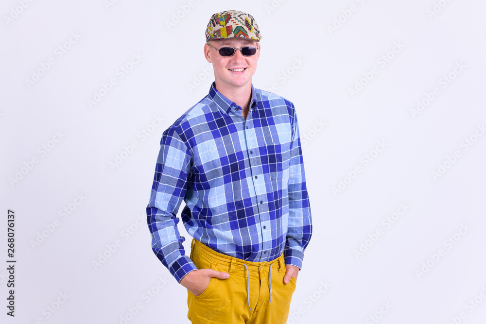Happy young hipster man with sunglasses smiling Happy young hipster man with sunglasses smiling