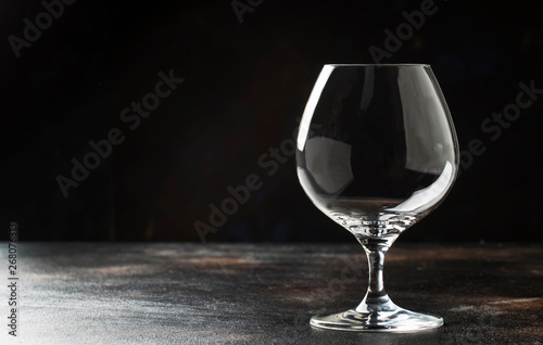 Empty brandy or cognac glass, copy space, selective focus