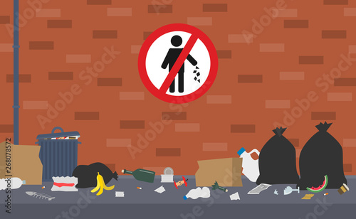 dirty street  trash can bags  plastic glass food waste no litter sign on brick wall