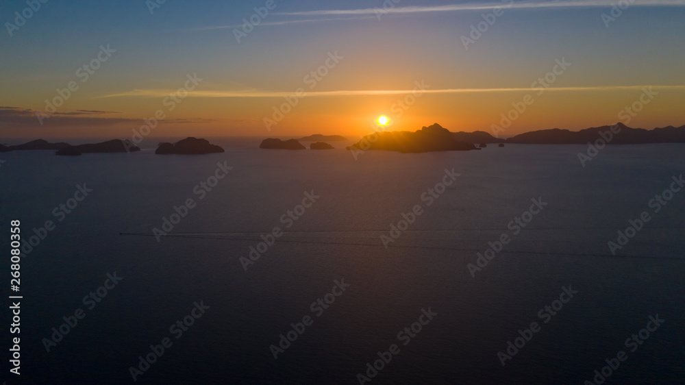 Sunset over the sea with the islands. Seascape with sunset aerial view