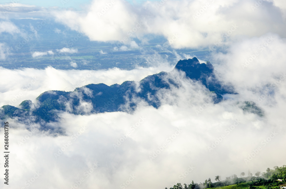 White clouds covered the mountains in the morning with a blurred pattern background White clouds covered the mountains in the morning with a blurred pattern background
