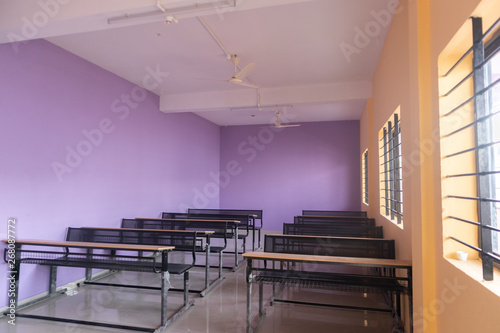 Empty class room and desks with colorful walls