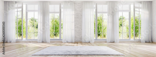 White interior design with large windows