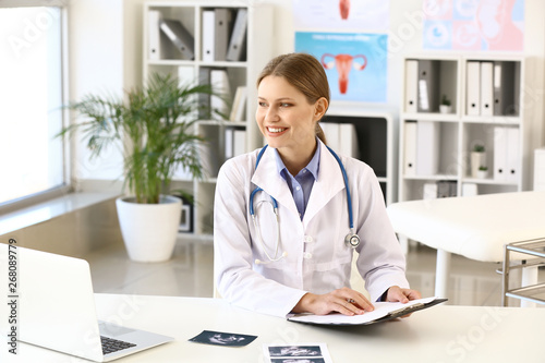 Young gynecologist working ...