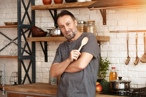 Handsome mature man cooking...