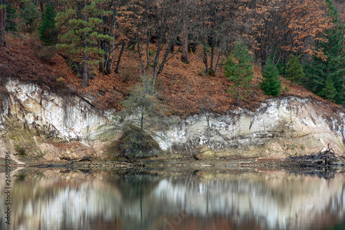 Reflections of white cliffs in autumn in Lake Britton  California  USA