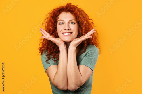 Happy redhead woman on color background