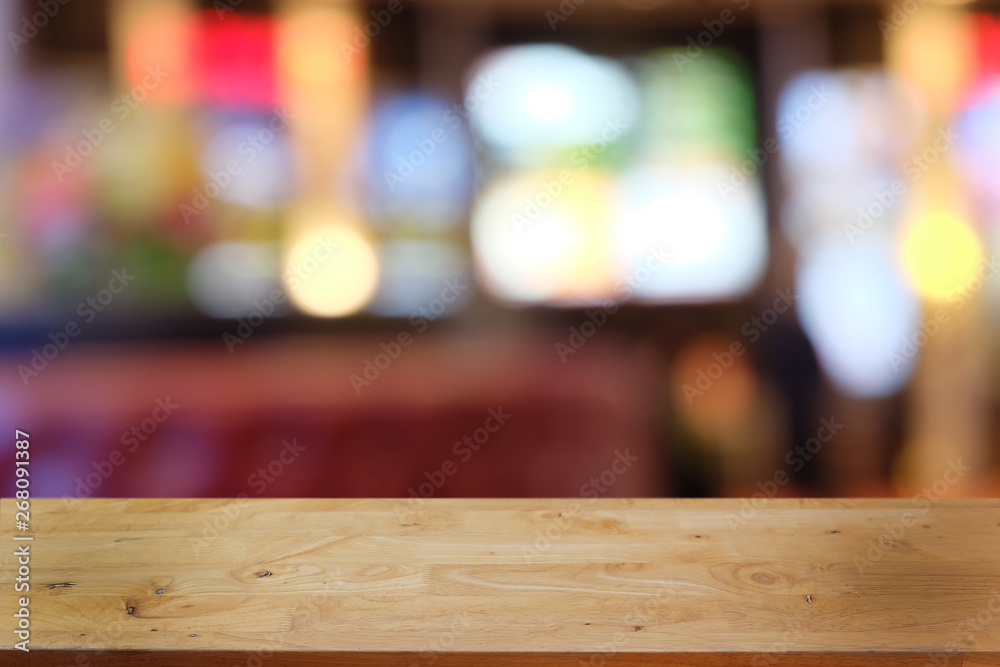 Empty dark wooden table in front of abstract blurred bokeh background of restaurant . can be used for display or montage your products.Mock up for space. Empty dark wooden table in front of abstract blurred bokeh background of restaurant . can be used for display or montage your products.Mock up for space.