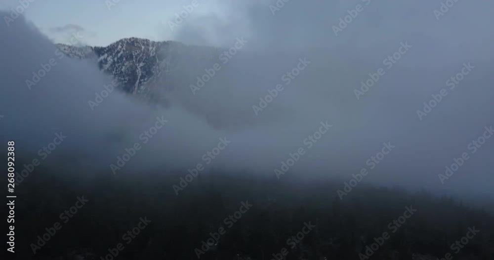 Enchanted deep foggy mountains of crystal lake San Gabriel alps, drone shot Enchanted deep foggy mountains of crystal lake San Gabriel alps, drone shot