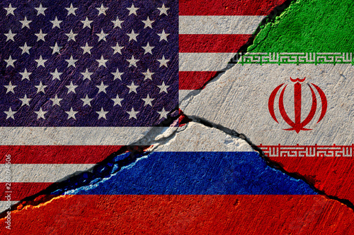concrete wall with painted united states, russia and iran flags